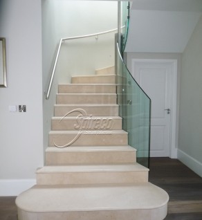 Marble Clad Stairs with Glass Balustrade